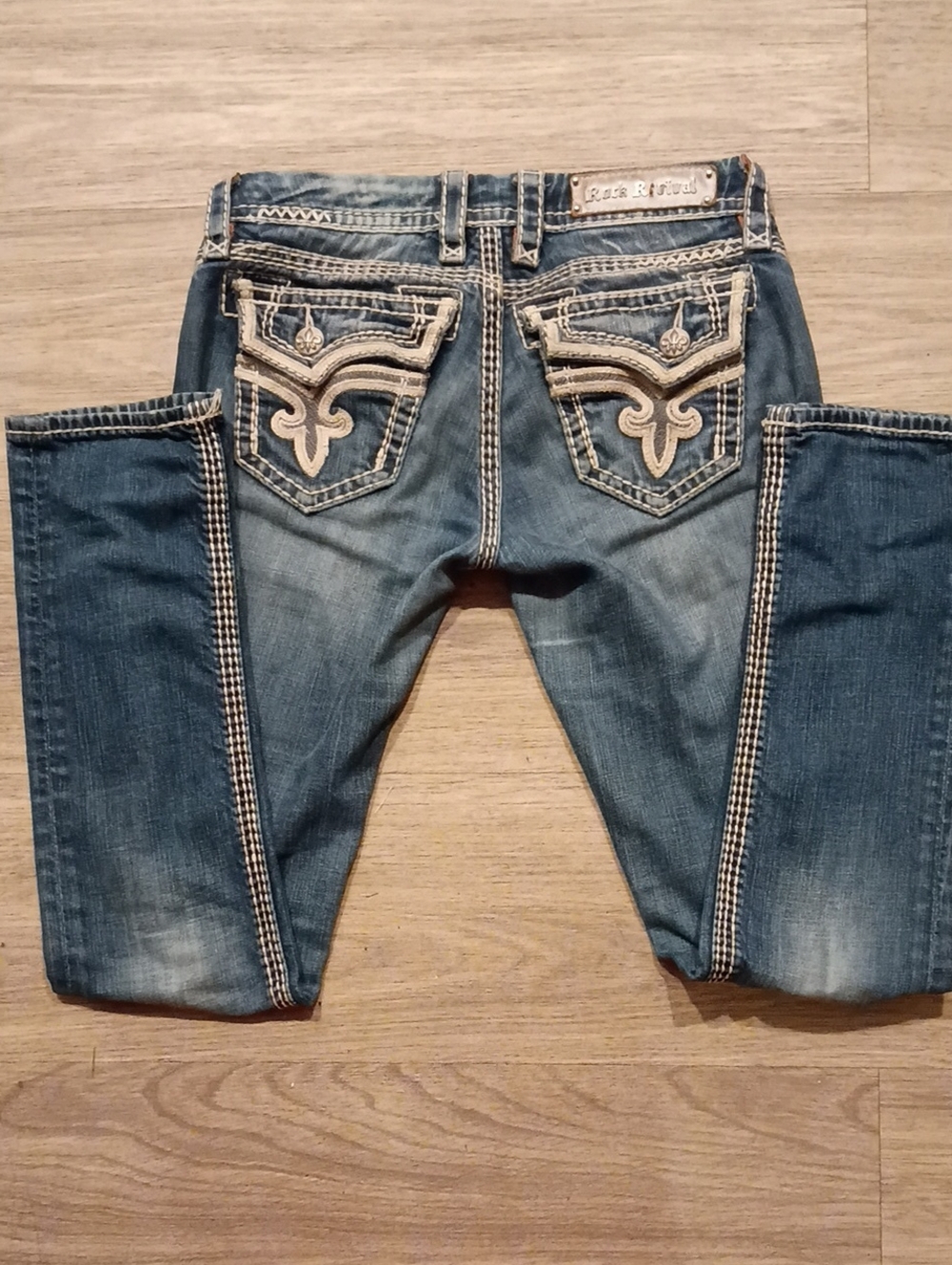 Rock Revival Distressed Blue Denim Jeans with White Embroidered Pockets